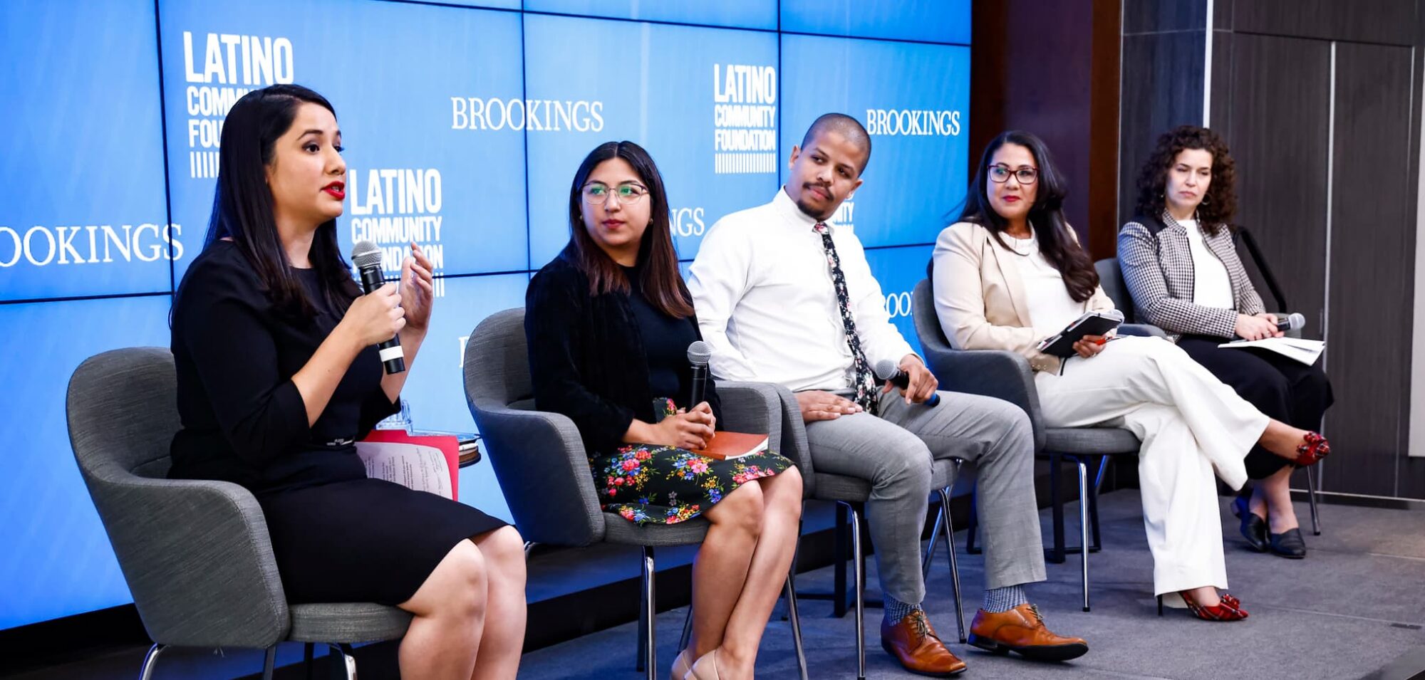 Panelists on the stage during a Brookings event