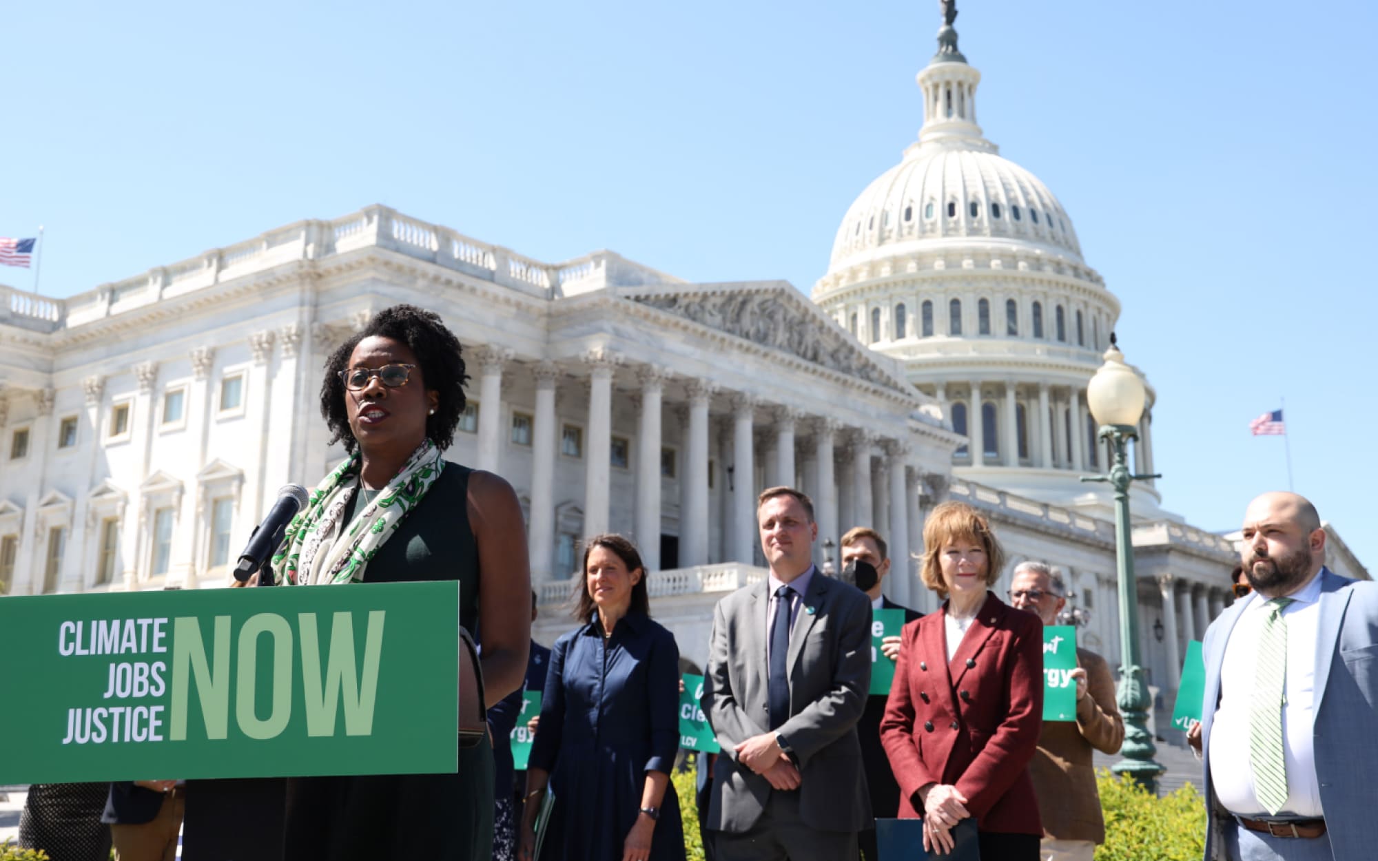 Black woman giving a speech outside the Capitol building