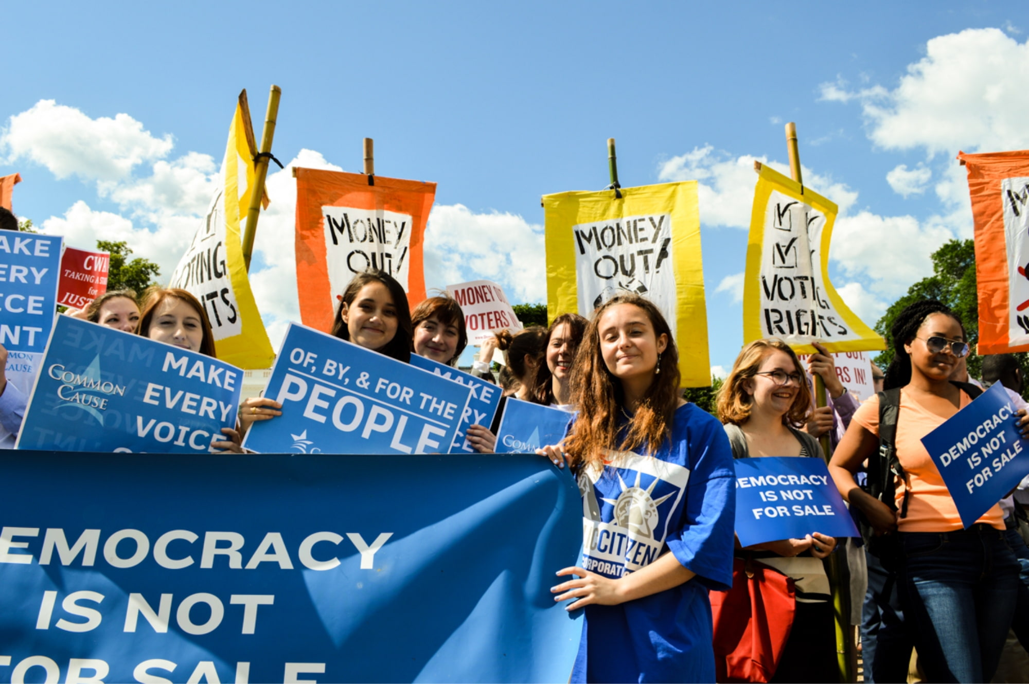 Image of young activists at a rally for driving money out of politics