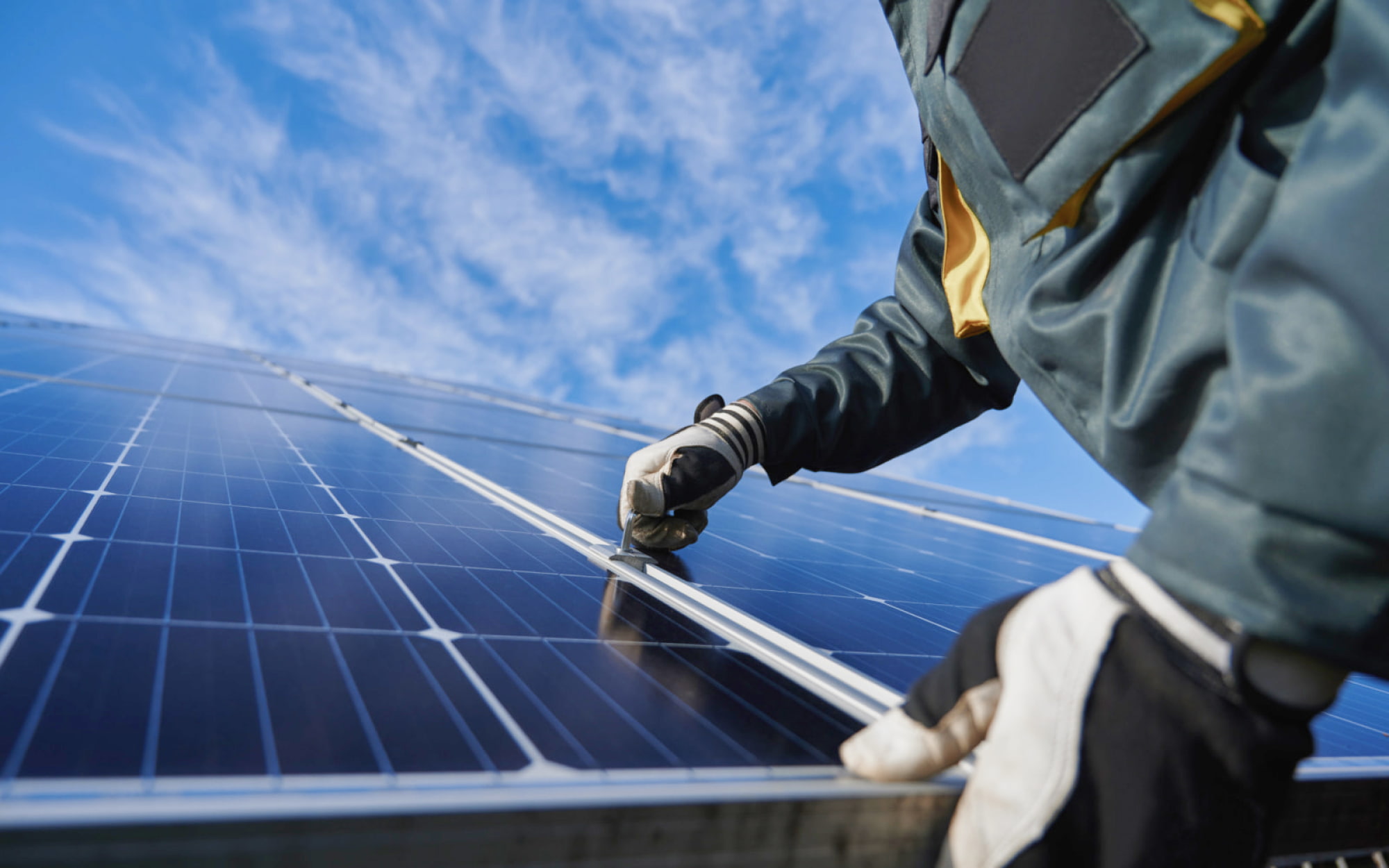 Worker with a solar panel